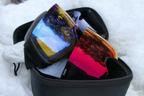 This photo shows the Smith 4D MAG snow goggle with two lenses and the included carrying case.