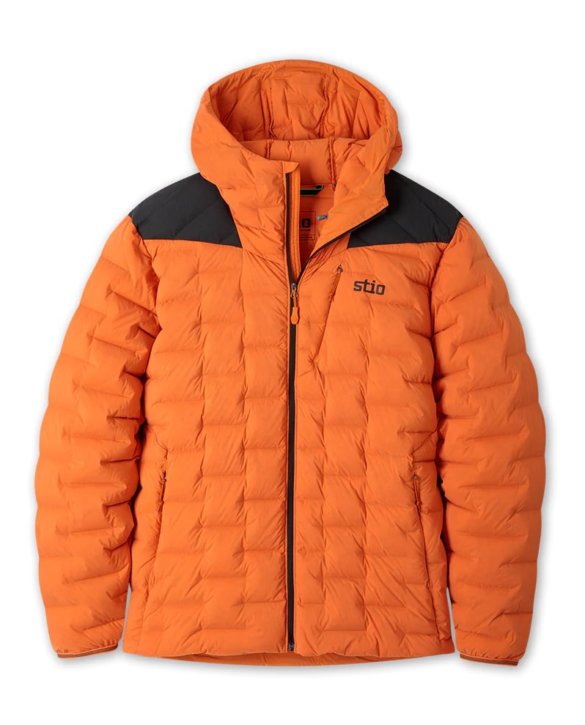 This photo shows the men's Stio Skillet Stretch Down Hooded Jacket in the Basecamp Orange color option.