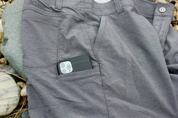 This review testing photo shows how a large smartphone easily fits into a KUHL smartphone pocket.