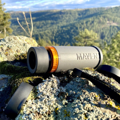 This photo shows the Maven CM.1 Monocular on a rock outside during the testing and review process.