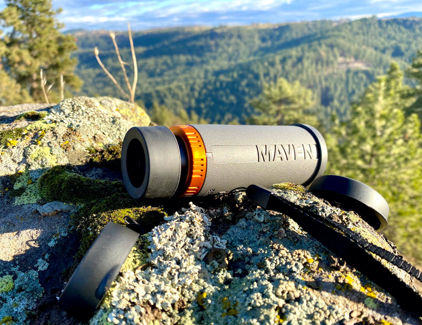 This photo shows the Maven CM.1 Monocular on a rock outside during the testing and review process.