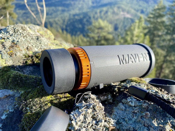This review photo shows the Maven CM.1 Monocular outside in a forest during the testing process.