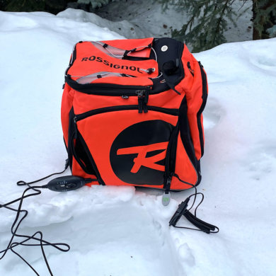 This review photo shows the Rossignol Hero Heated Boot Bag outside on a snowbank.