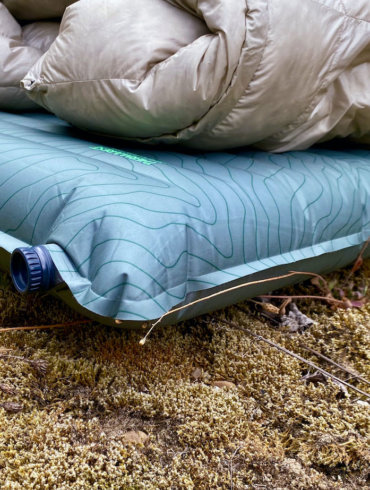 This review photo shows the Therm-a-Rest NeoAir TopoLuxe Sleeping Pad with a sleeping bag during the testing process.