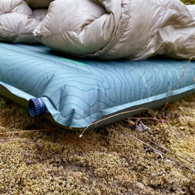 This review photo shows the Therm-a-Rest NeoAir TopoLuxe Sleeping Pad with a sleeping bag during the testing process.