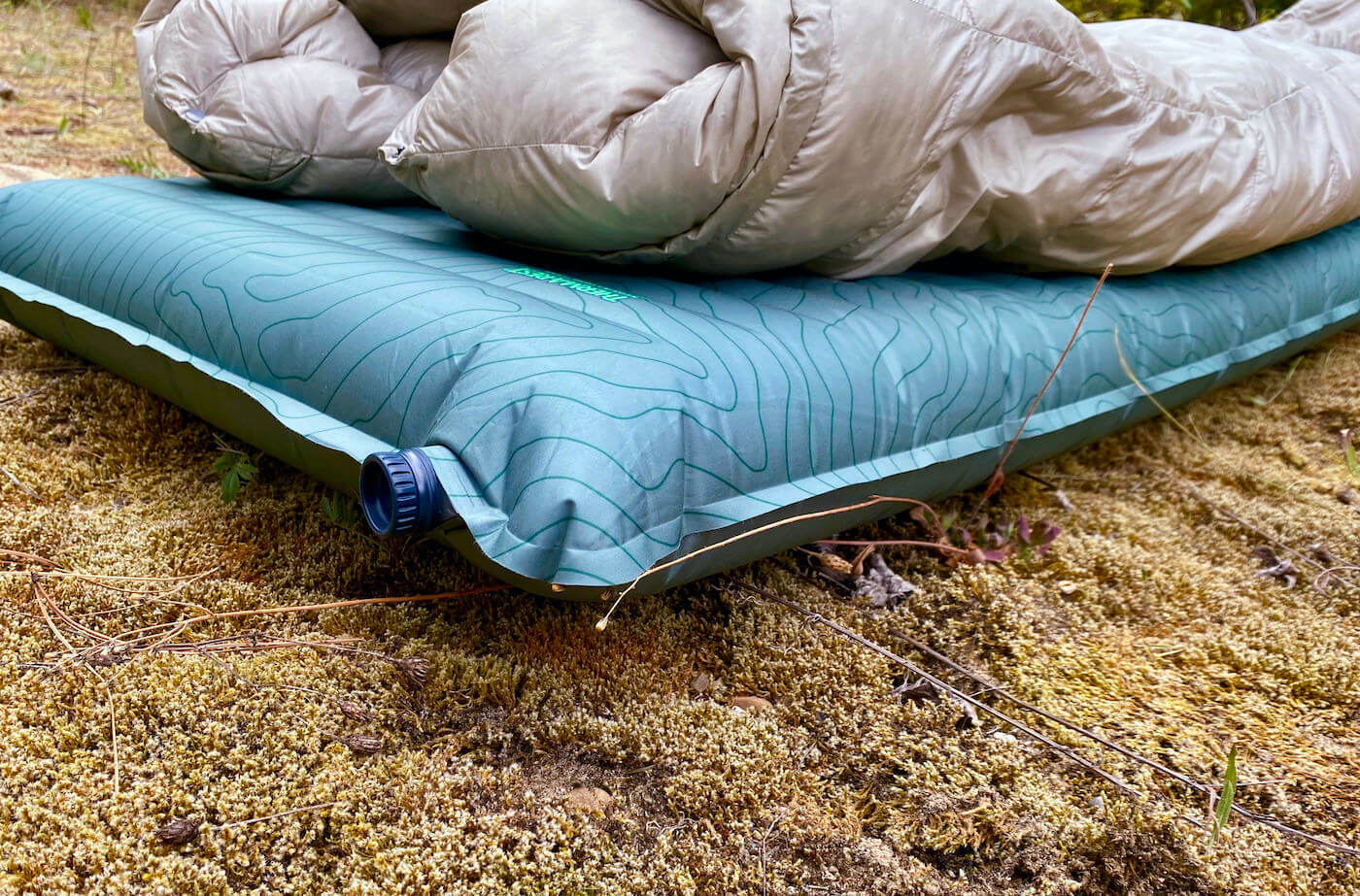 This review photo shows the Therm-a-Rest NeoAir TopoLuxe Sleeping Pad with a sleeping bag during the testing process.