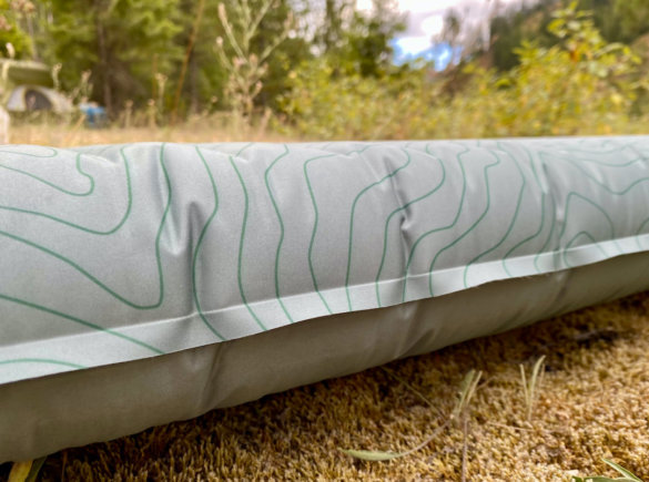 This photo shows a side profile of the Therm-a-Rest NeoAir Topo Luxe Sleeping Pad.