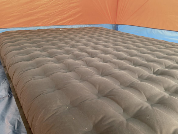 This photo shows the REI Co-op Kingdom Insulated Air Bed inside of a tent.