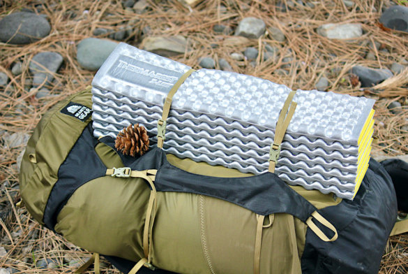 This photo shows the Therm-a-Rest Z Lite SOL Sleeping Pad strapped to a backpacking backpack.