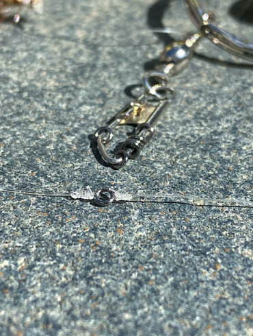 This photo shows a tippet ring attached to a fly fishing leader and tippet as well as tippet rings on a snap swivel.