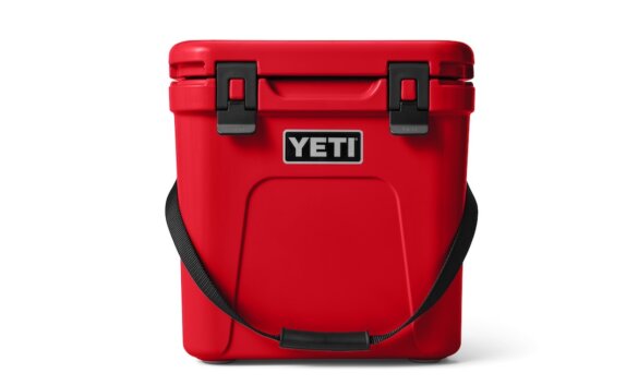 This photo shows the YETI Roadie 24 hard cooler in the 'Rescue Red' limited edition color option.
