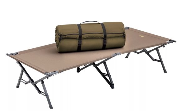 This photo shows the Cabela's 3" Cot Pad rolled up on a camping cot.