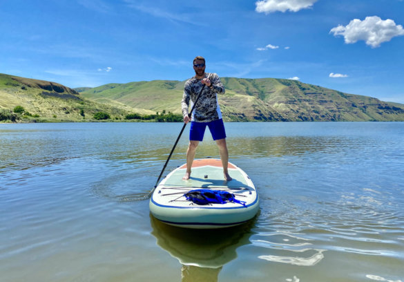 This photo shows the author paddling the ISLE Megalodon 2.0 iSUP during the testing and review process.