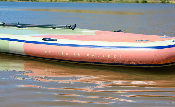 This photo shows a closeup of the ISLE Megalodon 2.0 15-foot paddle board. 