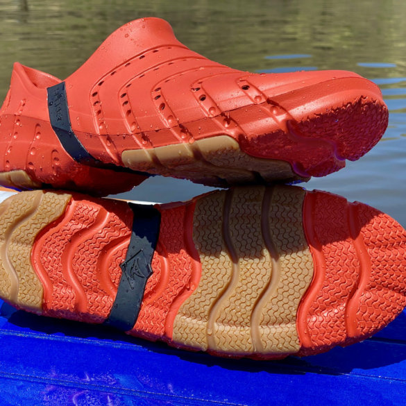 This review photo shows the Sperry Water Strider water shoes outside near a lake during the testing process.