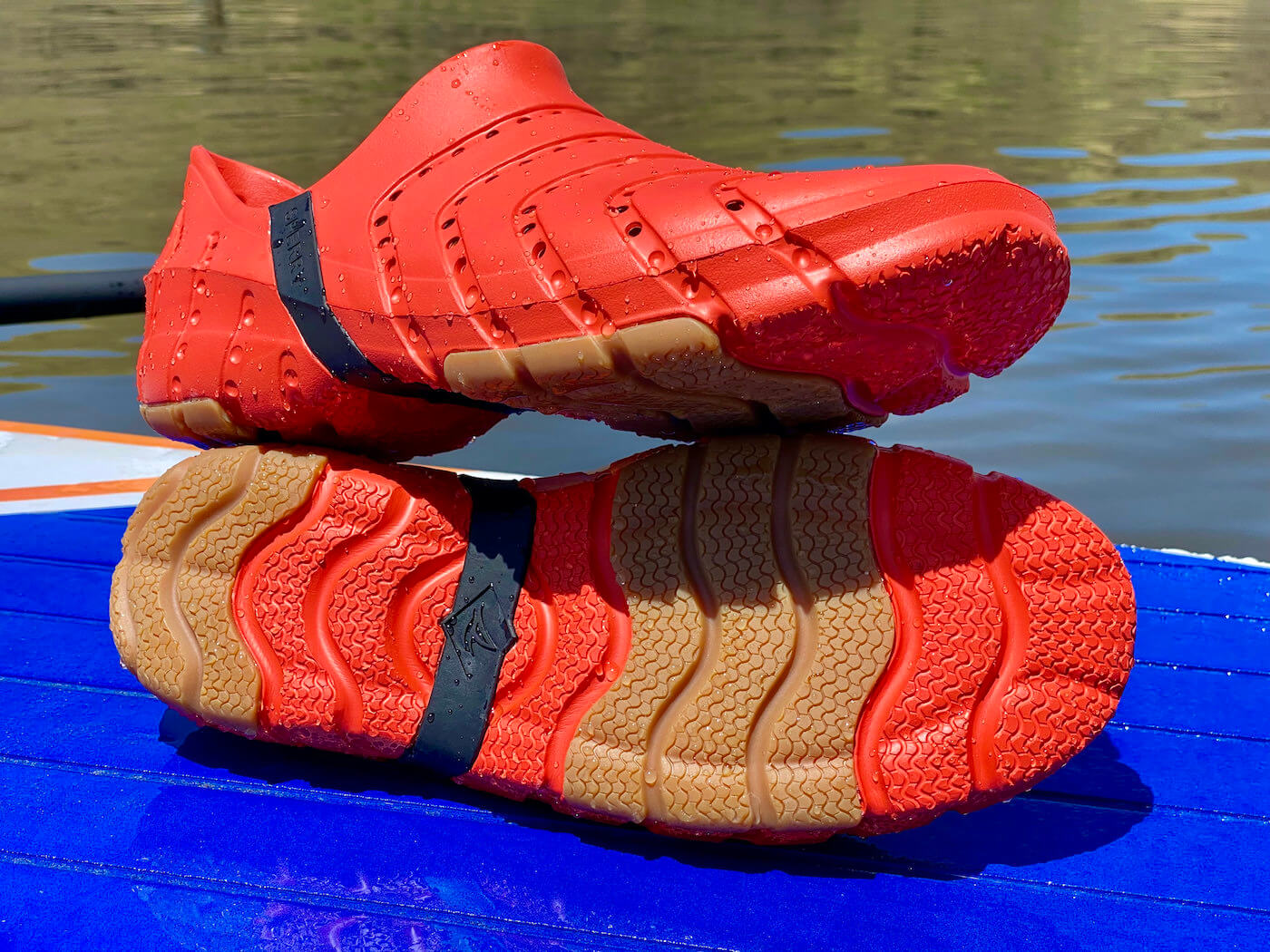 This review photo shows the Sperry Water Strider water shoes outside near a lake during the testing process.