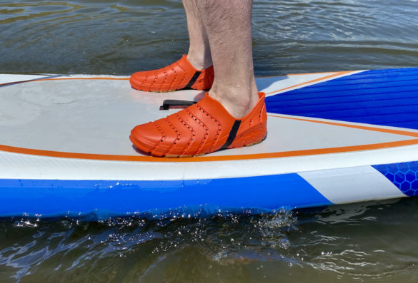 This photo shows the author wearing the Sperry Water Strider shoes while stand-up paddle boarding during the review process.