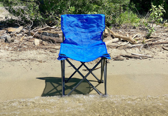 This photo shows the ALPS Mountaineering Adventure Chair outside on a beach during the review and testing process.