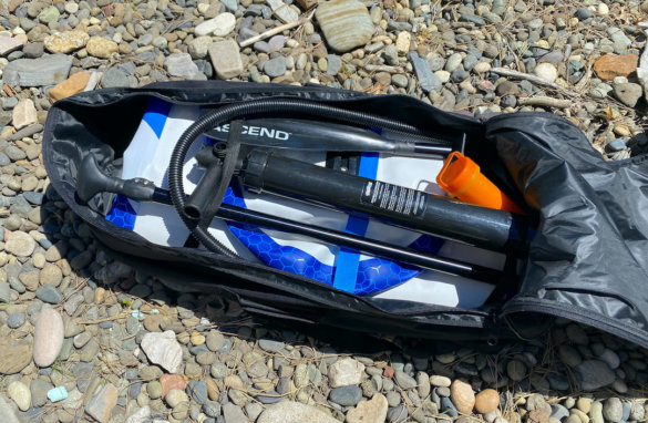 This photo shows the included backpack carry case with the Bass Pro Shops Ascend Inflatable Stand-Up Paddleboard Package components inside.