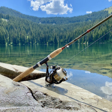 This photo shows the L.L.Bean Double L Travel Spin Outfit near a mountain lake during the testing and review process.