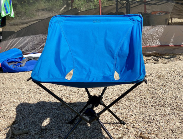 This photo shows the REI Co-op Flexlite Camp Boss Chair on a beach in sunlight.