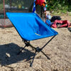 This photo shows the REI Co-op Flexlite Camp Boss Chair outside on a beach during the testing and review process.