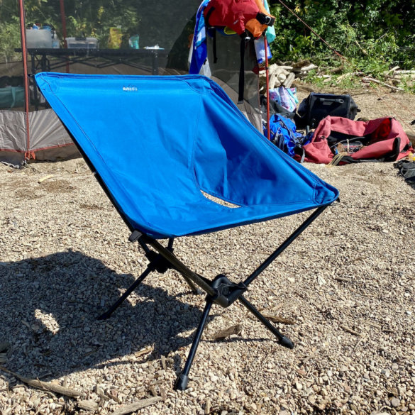 This photo shows the REI Co-op Flexlite Camp Boss Chair outside on a beach during the testing and review process.