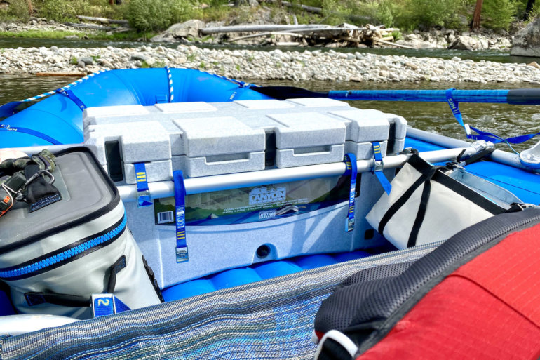 This photo shows the Canyon Coolers Prospector 103 cooler mounted in a whitewater raft frame on the Middle Fork of the Salmon River in Idaho during the review and testing process.