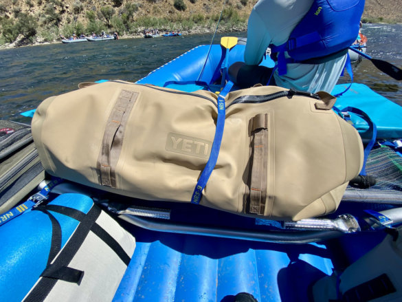 This photo shows the YETI Panga 110L Waterproof Duffel on a raft during the testing and review process.