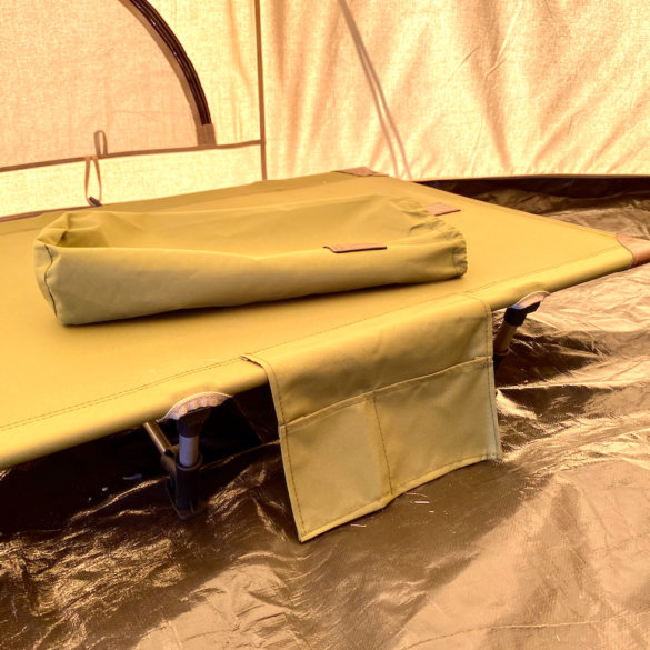 This review photo shows the Kijaro Native Ultralight Cot set up inside of a camping tent.