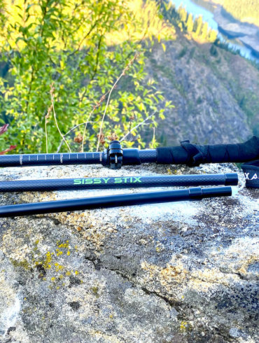 This photo shows the PEAX Backcountry Z Sissy Stix on a rock in rugged terrain during the testing and review process.