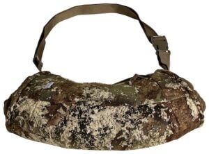 This photo shows the camouflage Cabela's GORE-TEX Infinium Windstopper Handmuff for hunters.