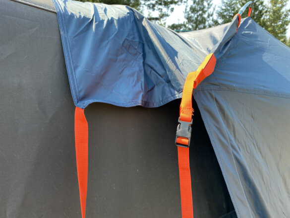 This photo shows a closeup of the Kelty Backroads Shelter as its connected to a vehicle. 