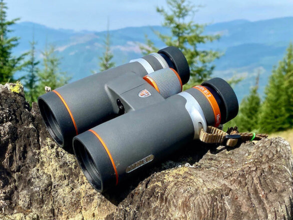 This best gifts for hunters photo shows a pair of Maven B1.2 10x42 binoculars outside during a hunt.