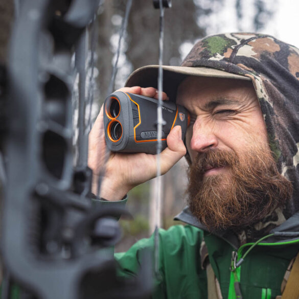 This photo shows an archery hunter using the Maven CRF.1 Rangefinder.