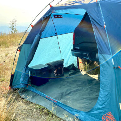 This photo shows the Kelty Backwoods Shelter set up on the author's pickup with a soft-topper.