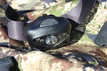 This review photo shows the Princeton Tec Vizz 550-lumen headlamp on a hunting backpack.