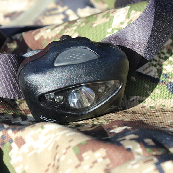 This review photo shows the Princeton Tec Vizz 550-lumen headlamp on a hunting backpack.
