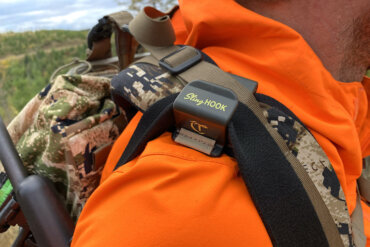 This photo shows the Talarik SlingHook attached to a backpack with a rifle sling for hunting.