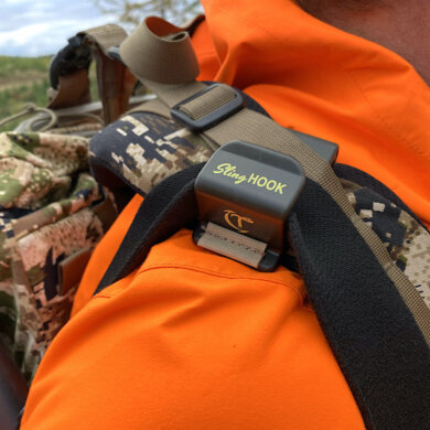 This photo shows the Talarik SlingHook attached to a backpack with a rifle sling for hunting.