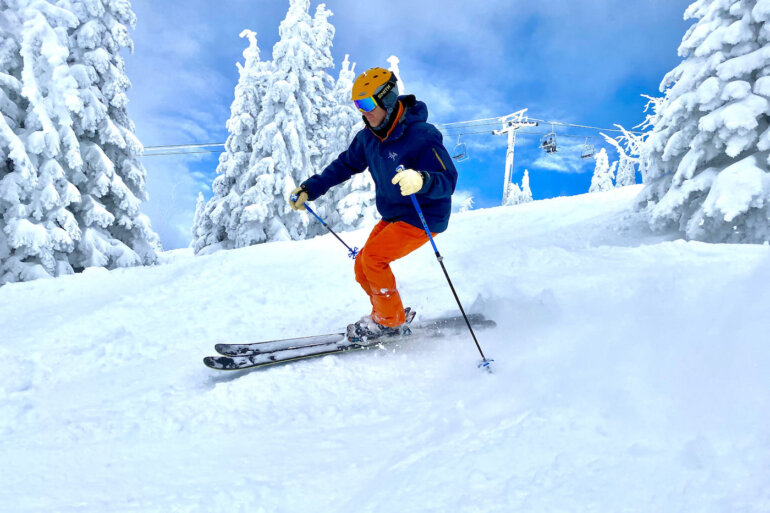 This photo shows a gear tester wearing the Helly Hansen Legendary Insulated Ski Pants while skiing during the review process.