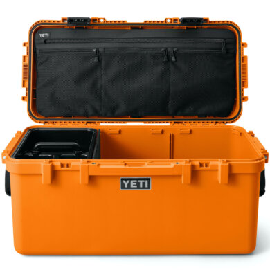 This photo shows the new YETI LoadOut GoBox 60 in the orange color option with its lid open.
