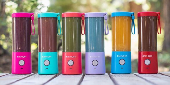 This photo shows several different BlendJet 2 blenders with smoothies inside each.