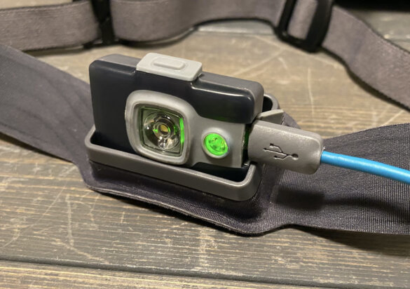 This photo shows the BioLite HeadLamp 325 headlamp recharging during the testing and review process.