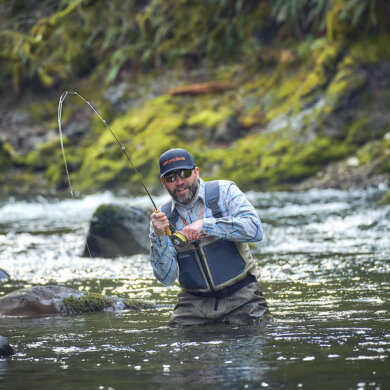 This photo shows a fly fisherman wading in the new Grundéns Boundary Zip Stockingfoot Wader.