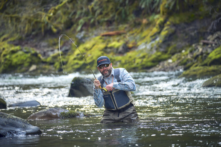 This photo shows a fly fisherman wading in the new Grundéns Boundary Zip Stockingfoot Wader.