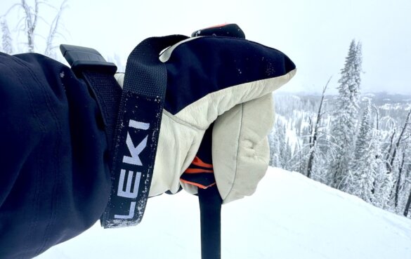 The author grips a ski pole with the Hestra Army Leather Heli Ski Mitt while skiing.