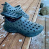 This review photo shows a pair of the Kane Revive active recovery shoes on a porch outside.
