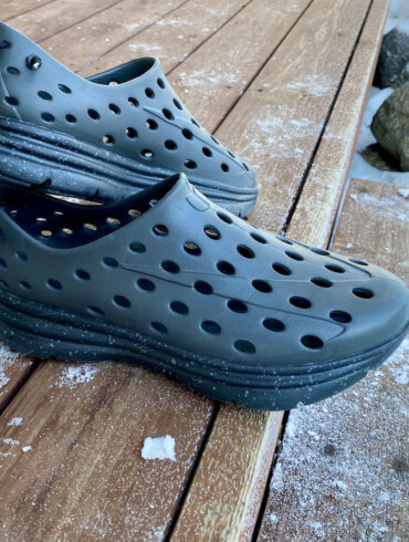 This review photo shows a pair of the Kane Revive active recovery shoes on a porch outside.