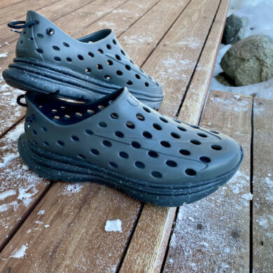 This review photo shows a pair of the Kane Revive active recovery shoes on a porch outside.